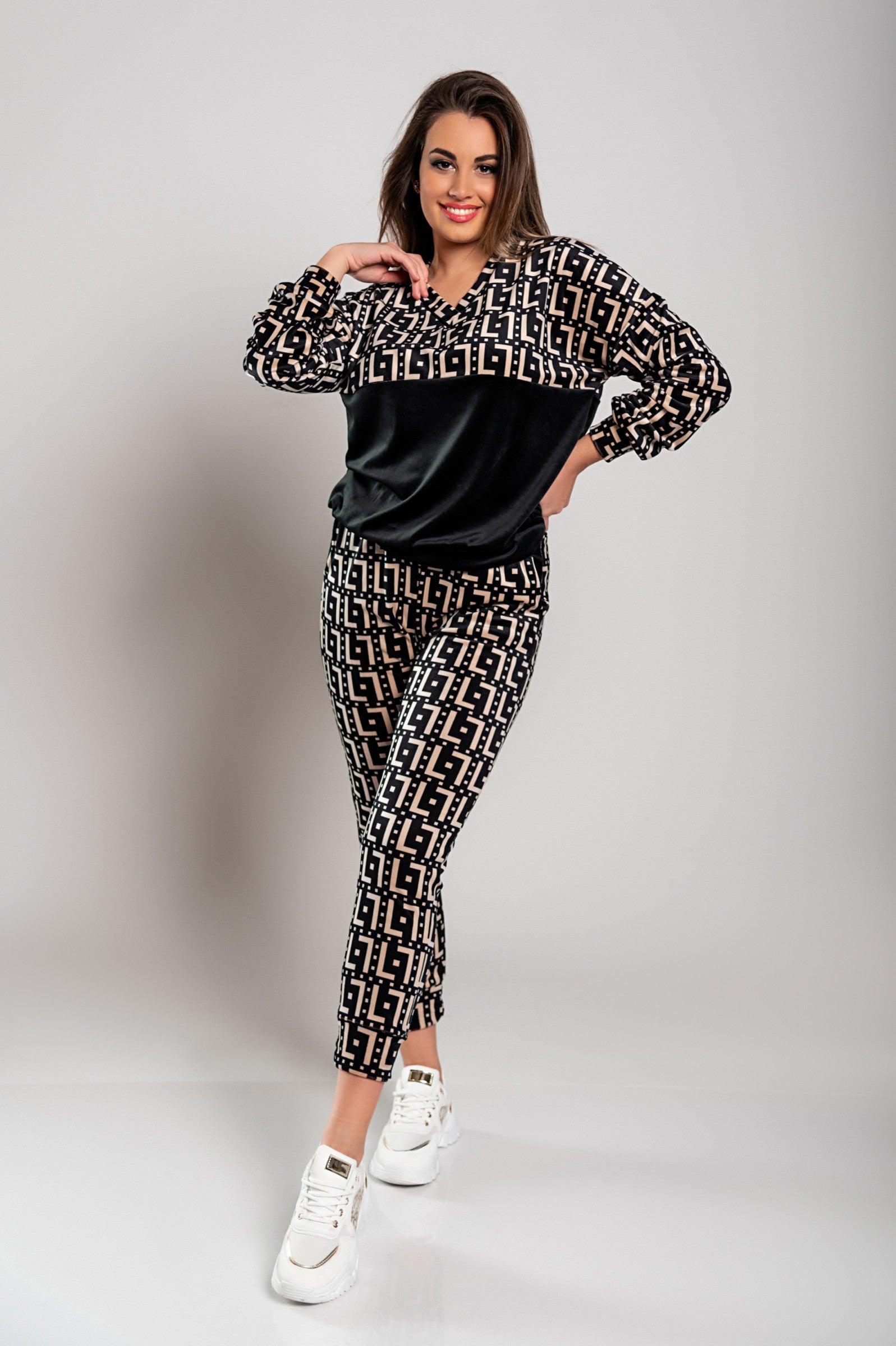 Woman wearing patterned sweat suit.