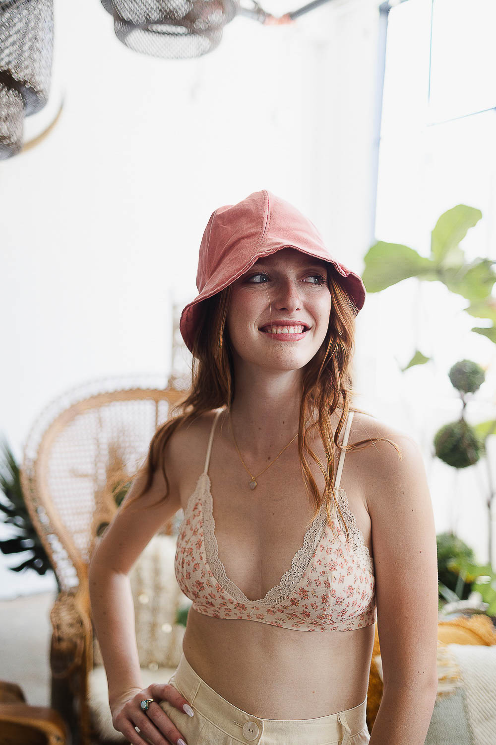 A colorful cotton bucket hat displayed against a bright background, showcasing its vibrant design and adjustable fit.