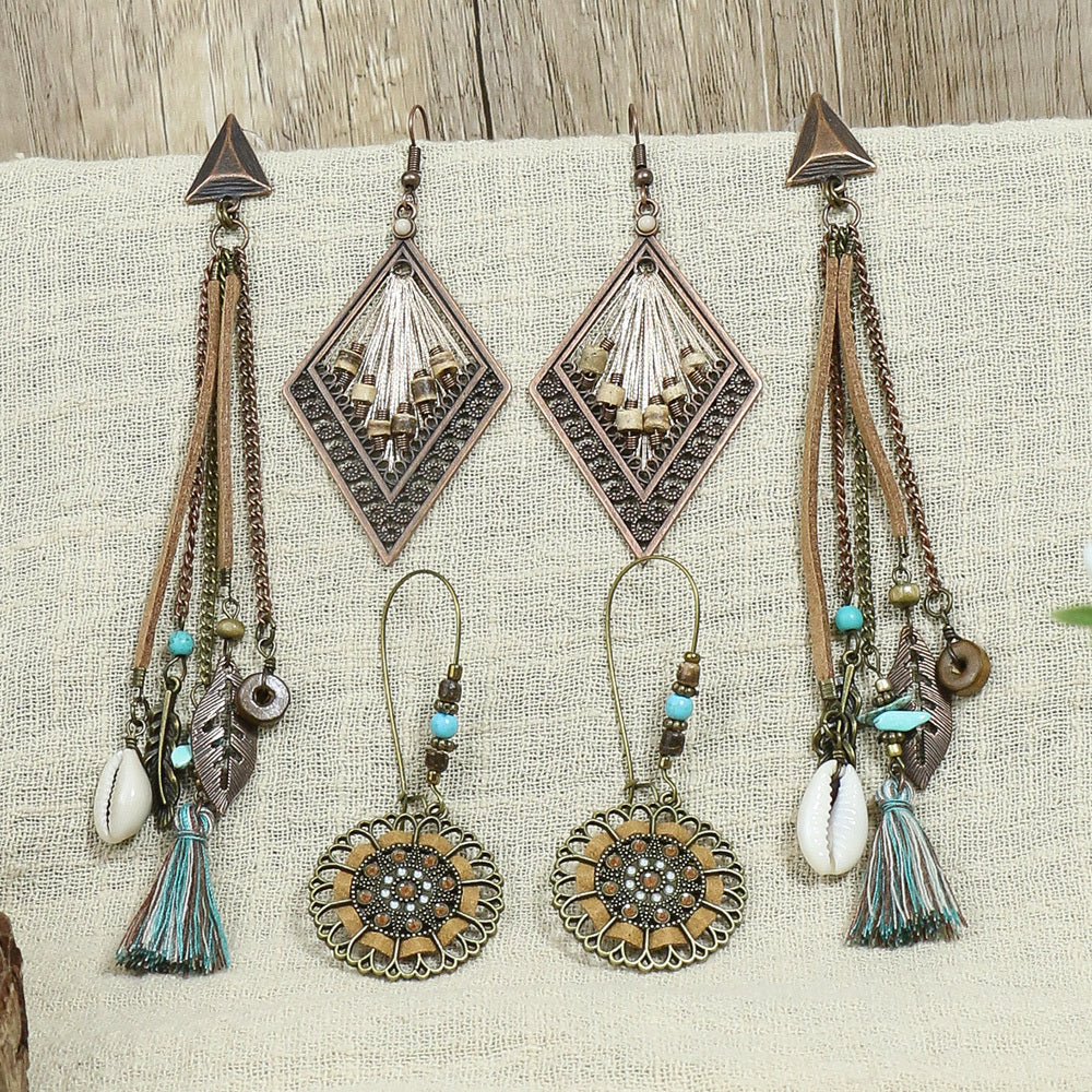 A beautiful set of vintage ethnic earrings featuring intricate designs and sparkling rhinestones, crafted from durable zinc alloy.