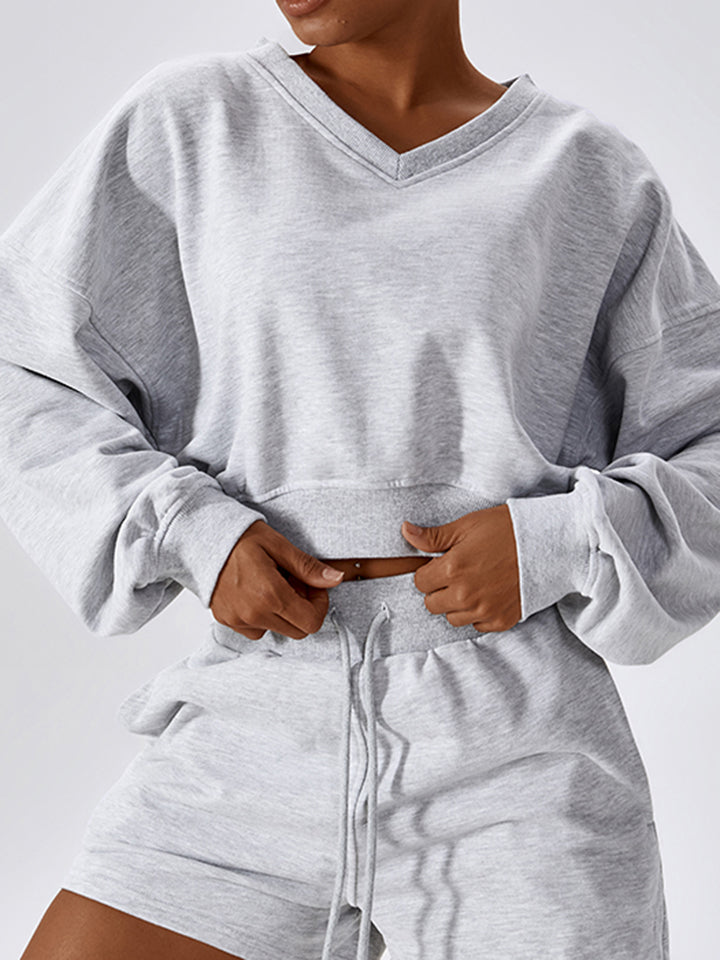 V-Neck Dropped Shoulder Sports Sweatshirt in solid color, showcasing its sporty design and comfortable fit.