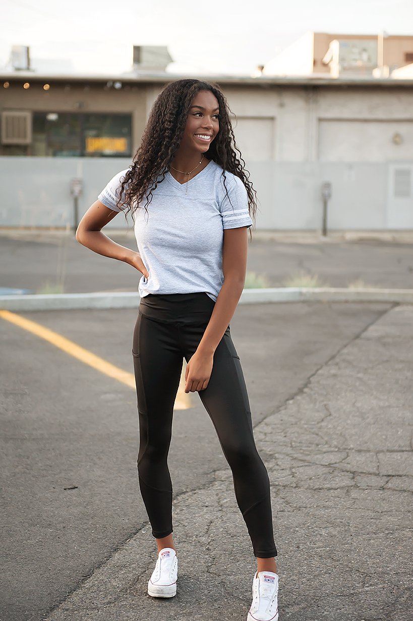 A stylish grey V-neck Game Day Tee displayed on a mannequin, showcasing its sporty design and comfortable fit.