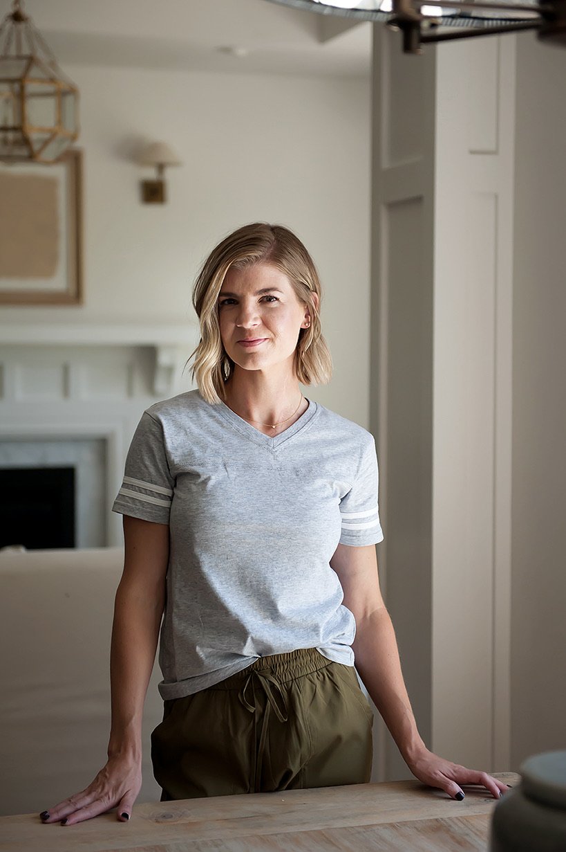 A stylish grey V-neck Game Day Tee displayed on a mannequin, showcasing its sporty design and comfortable fit.