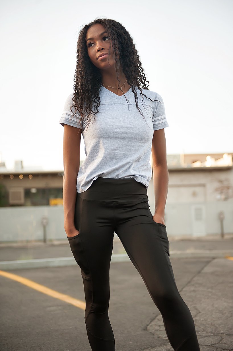 A stylish grey V-neck Game Day Tee displayed on a mannequin, showcasing its sporty design and comfortable fit.