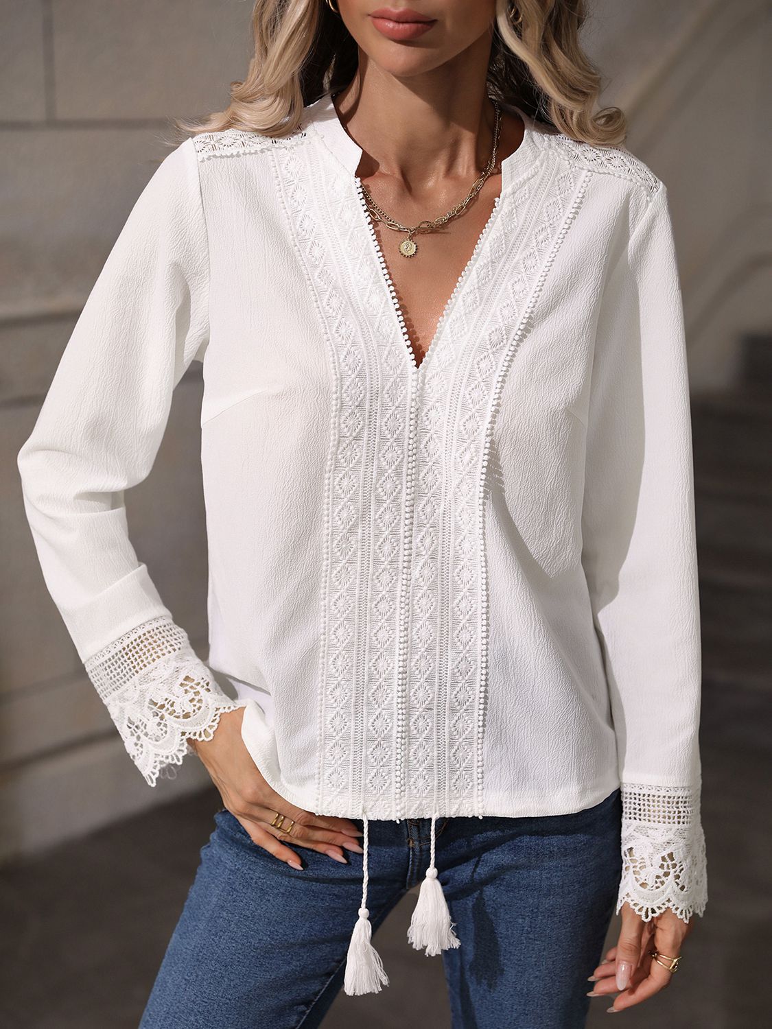 A stylish V-Neck Long Sleeve Lace Trim Blouse featuring a solid pattern, elegant lace trim, and a comfortable fit, displayed on a mannequin.