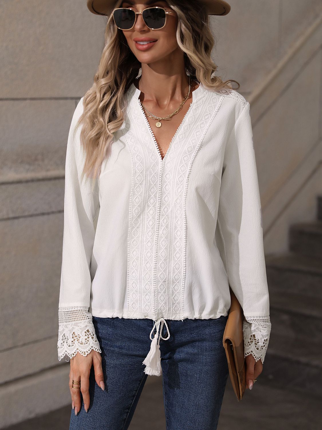 A stylish V-Neck Long Sleeve Lace Trim Blouse featuring a solid pattern, elegant lace trim, and a comfortable fit, displayed on a mannequin.