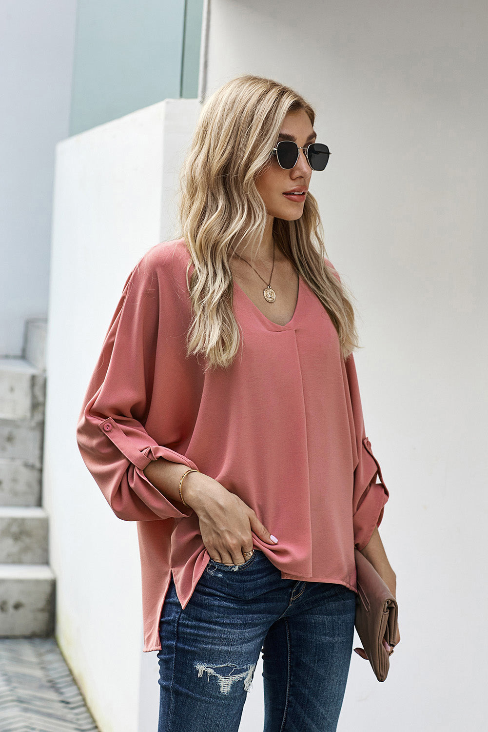 V-Neck Roll-Tab Sleeve Blouse in solid color, featuring three-quarter sleeves and a stylish V-neckline.