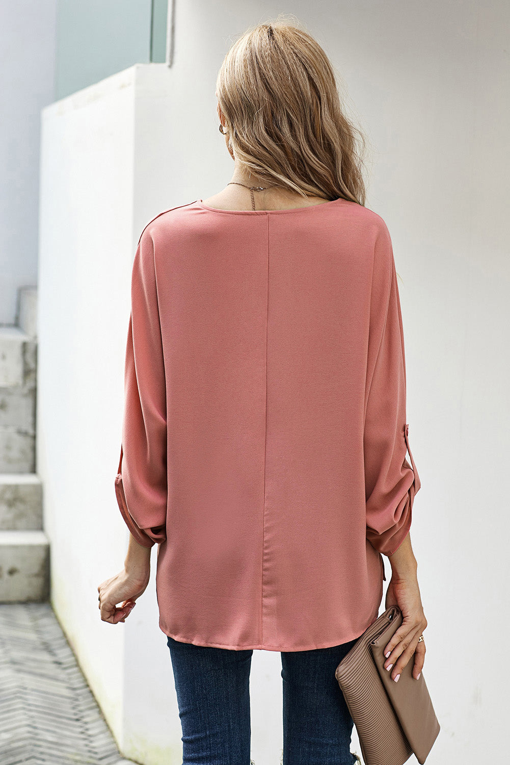 V-Neck Roll-Tab Sleeve Blouse in solid color, featuring three-quarter sleeves and a stylish V-neckline.