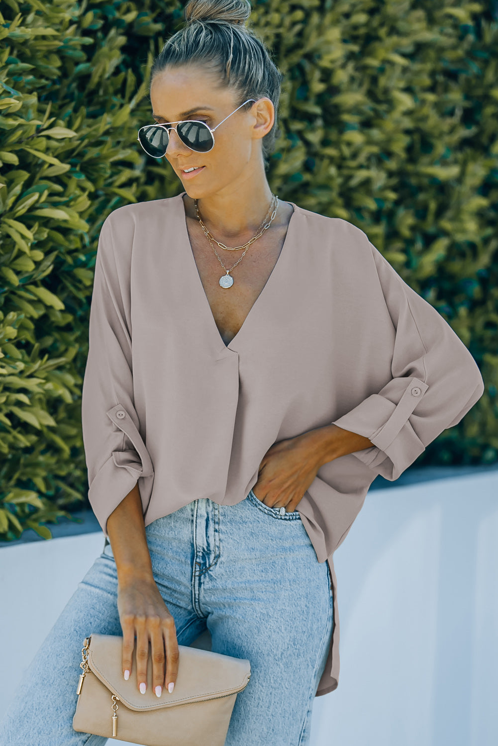 V-Neck Roll-Tab Sleeve Blouse in solid color, featuring three-quarter sleeves and a stylish V-neckline.