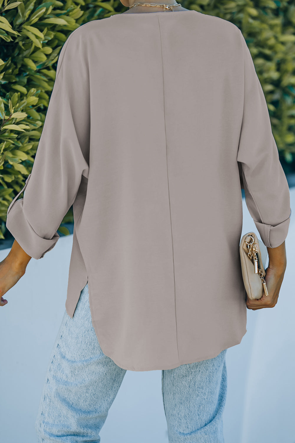 V-Neck Roll-Tab Sleeve Blouse in solid color, featuring three-quarter sleeves and a stylish V-neckline.