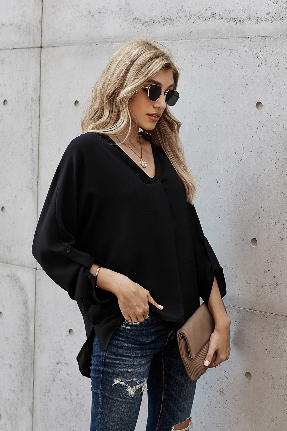 V-Neck Roll-Tab Sleeve Blouse in solid color, featuring three-quarter sleeves and a stylish V-neckline.