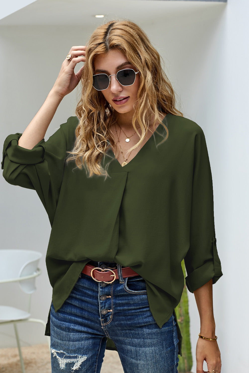 V-Neck Roll-Tab Sleeve Blouse in solid color, featuring three-quarter sleeves and a stylish V-neckline.