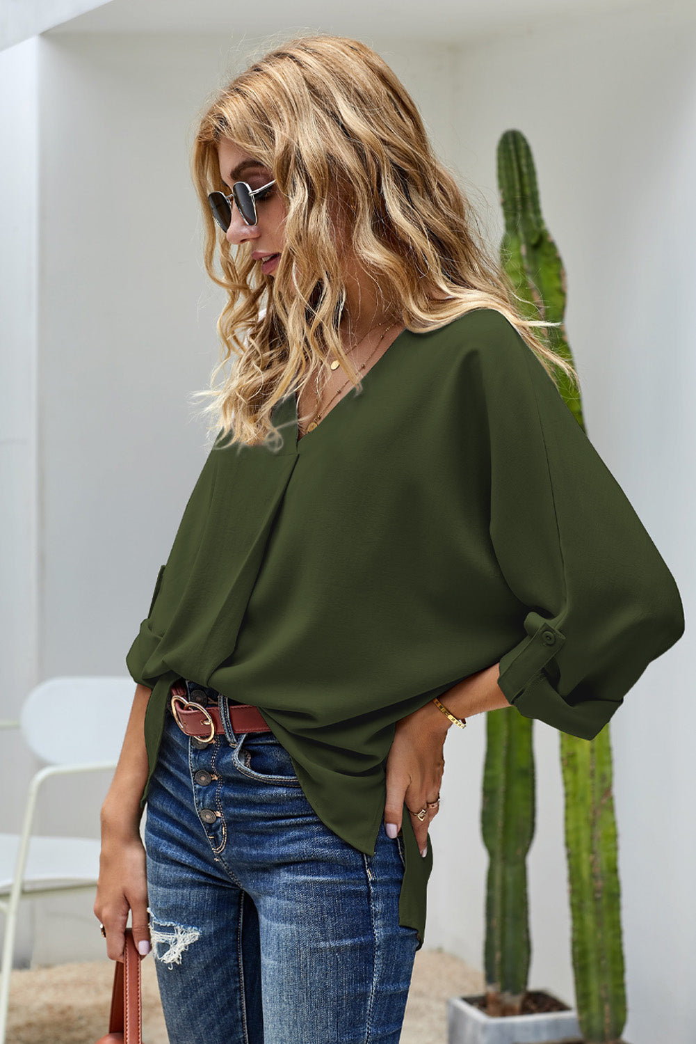 V-Neck Roll-Tab Sleeve Blouse in solid color, featuring three-quarter sleeves and a stylish V-neckline.