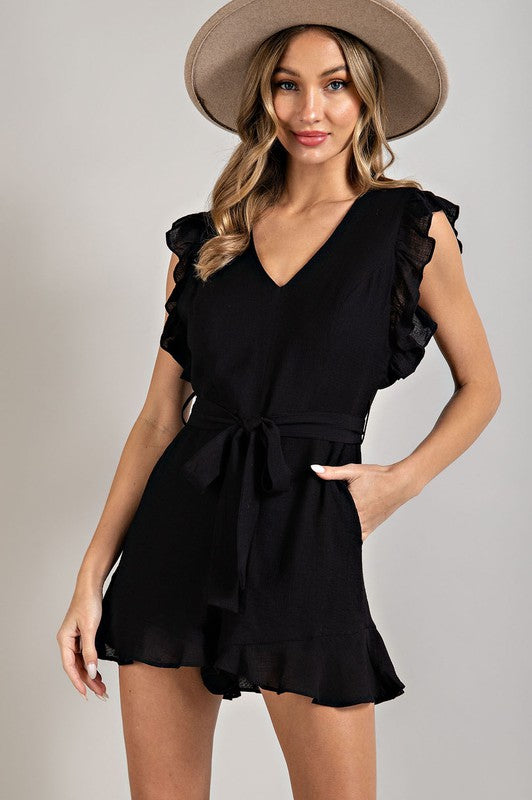 A stylish V-neck ruffled waist tie romper in a chic design, showcasing ruffle trim and a flattering silhouette.