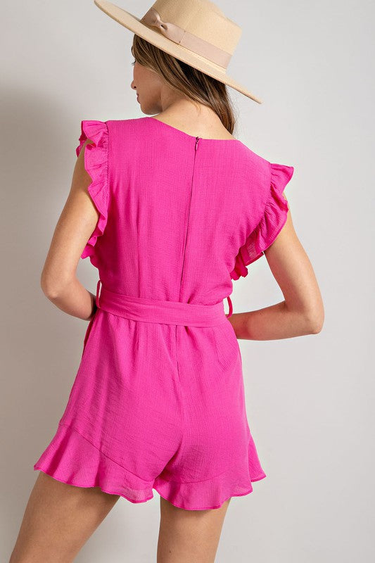 A stylish V-neck ruffled waist tie romper in a chic design, showcasing ruffle trim and a flattering silhouette.