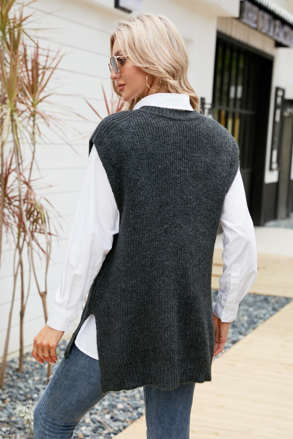 A stylish V-Neck Side Slit Sweater Vest in a solid color, featuring side slits and a long length, perfect for casual outdoor wear.