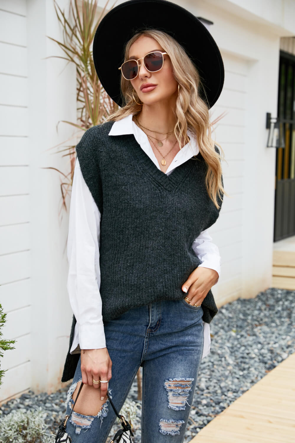 A stylish V-Neck Side Slit Sweater Vest in a solid color, featuring side slits and a long length, perfect for casual outdoor wear.