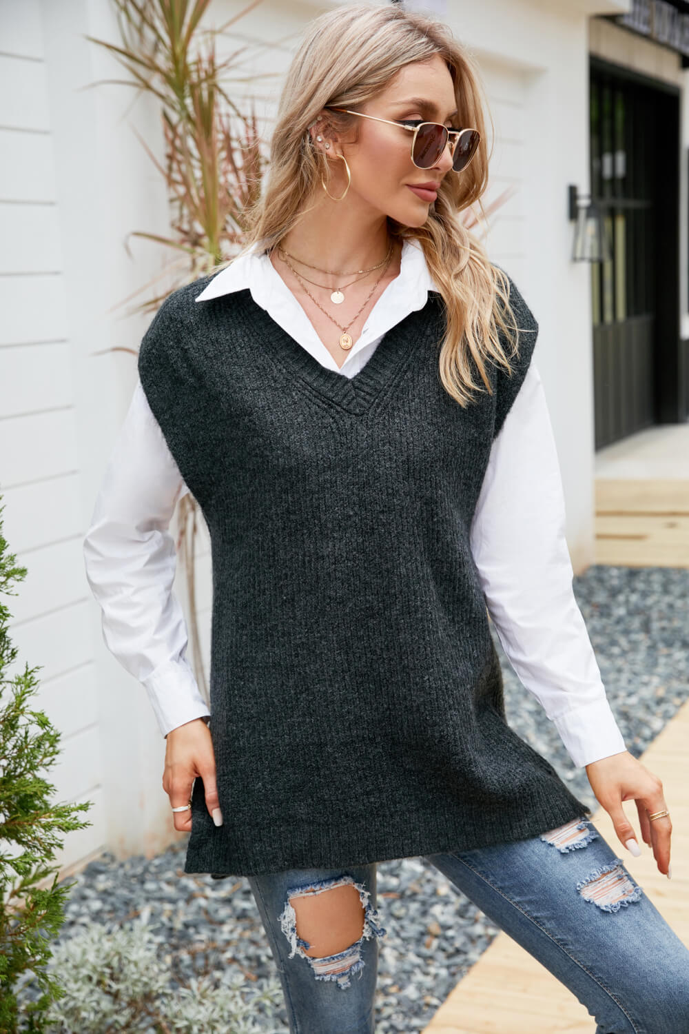 A stylish V-Neck Side Slit Sweater Vest in a solid color, featuring side slits and a long length, perfect for casual outdoor wear.