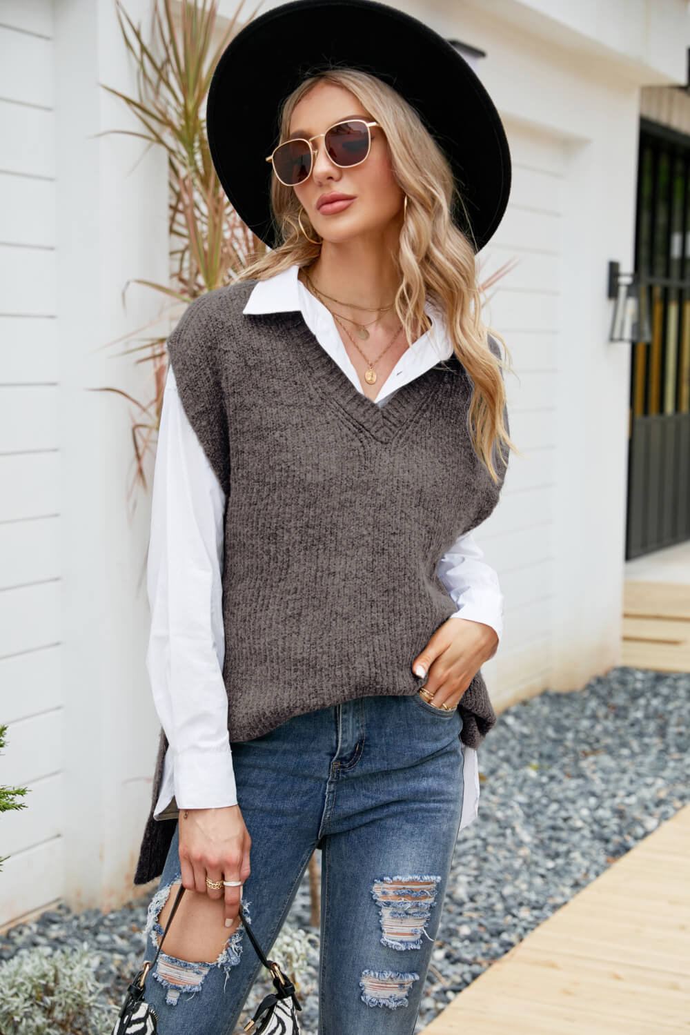 A stylish V-Neck Side Slit Sweater Vest in a solid color, featuring side slits and a long length, perfect for casual outdoor wear.