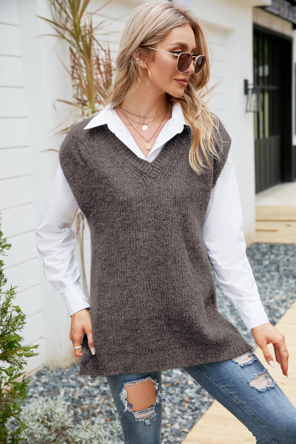 A stylish V-Neck Side Slit Sweater Vest in a solid color, featuring side slits and a long length, perfect for casual outdoor wear.