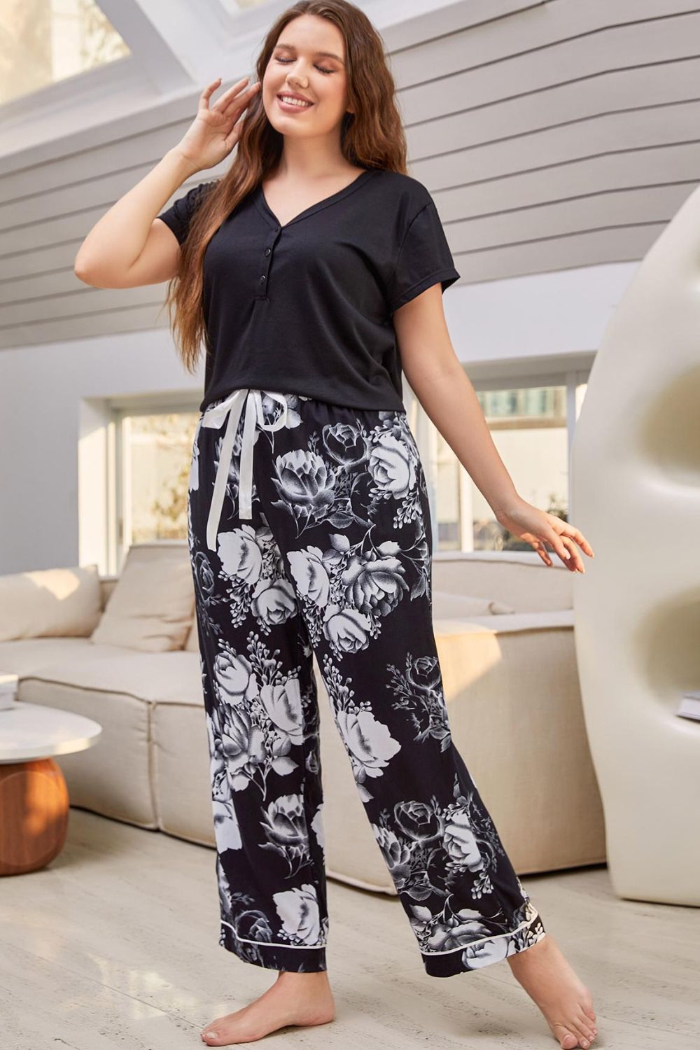 A stylish V-neck top paired with floral patterned pants, showcasing a comfortable lounge set for women.