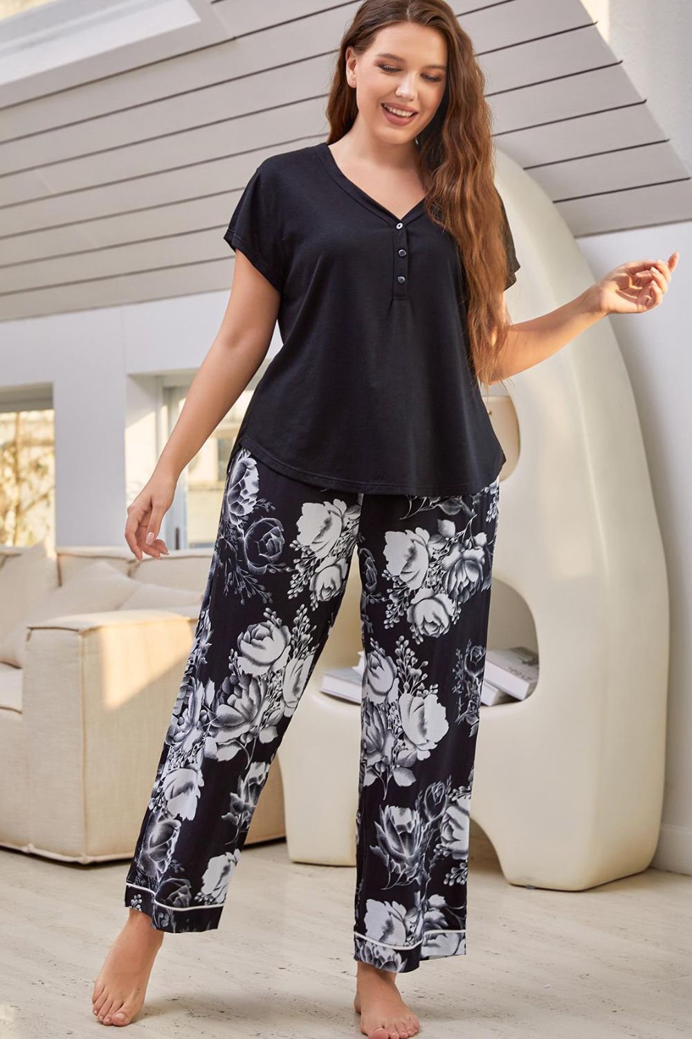 A stylish V-neck top paired with floral patterned pants, showcasing a comfortable lounge set for women.