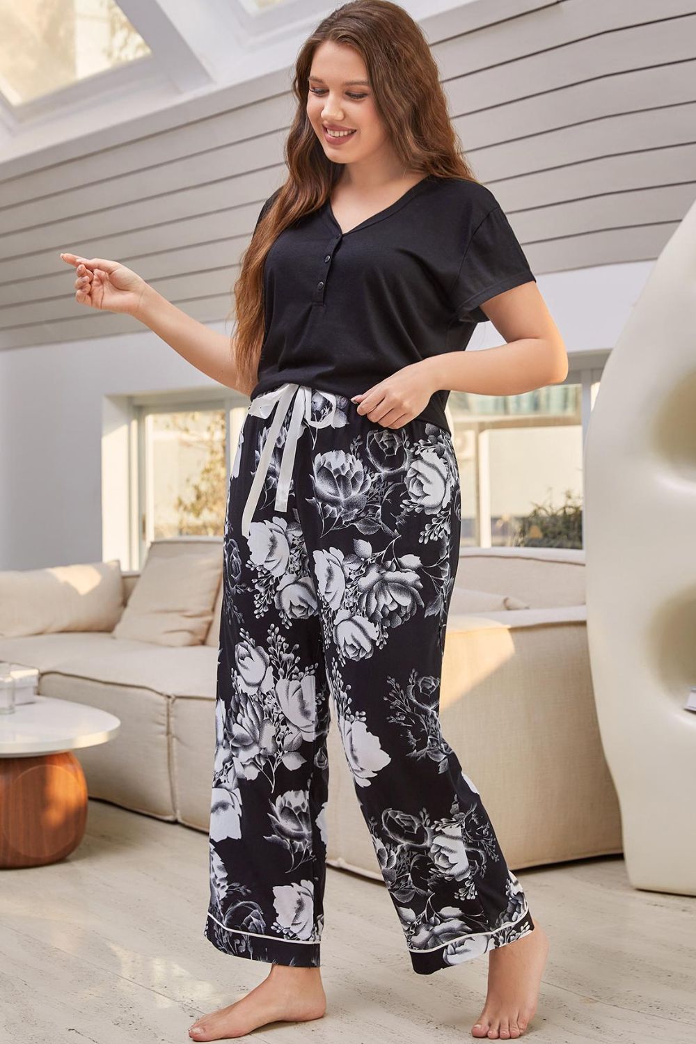 A stylish V-neck top paired with floral patterned pants, showcasing a comfortable lounge set for women.