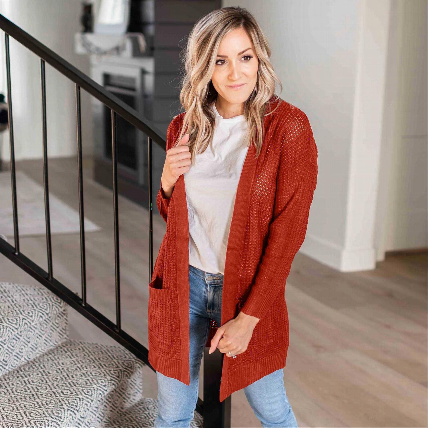 A stylish waffle knit pocketed long sleeve cardigan sweater in a soft fabric, featuring an open front and two large pockets, perfect for fall layering.