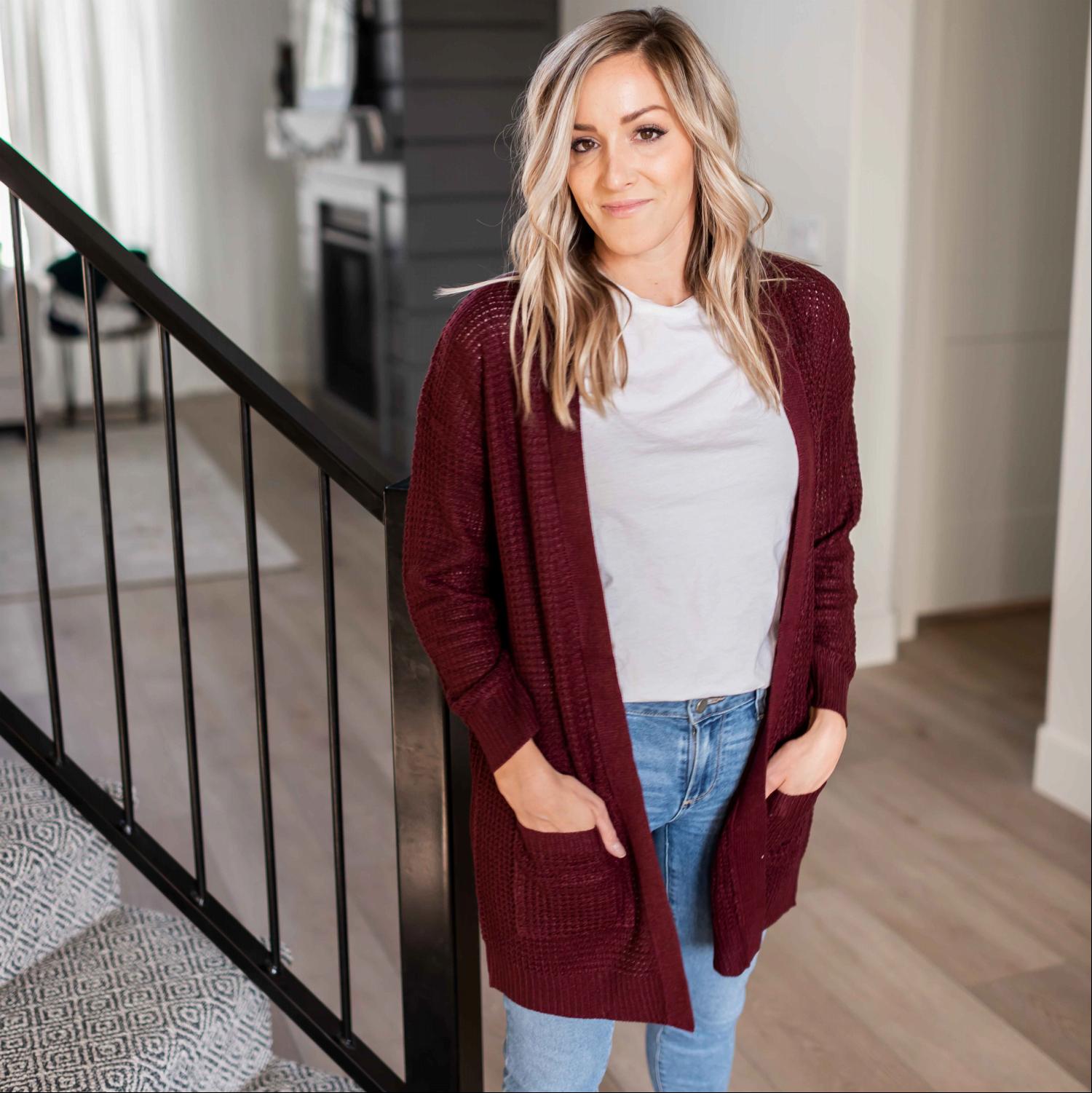 A stylish waffle knit pocketed long sleeve cardigan sweater in a soft fabric, featuring an open front and two large pockets, perfect for fall layering.