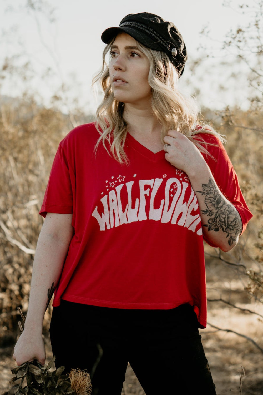 Wallflower Vintage V-Neck T-Shirt in bold red with psychedelic lettering, showcasing a relaxed fit and retro design.