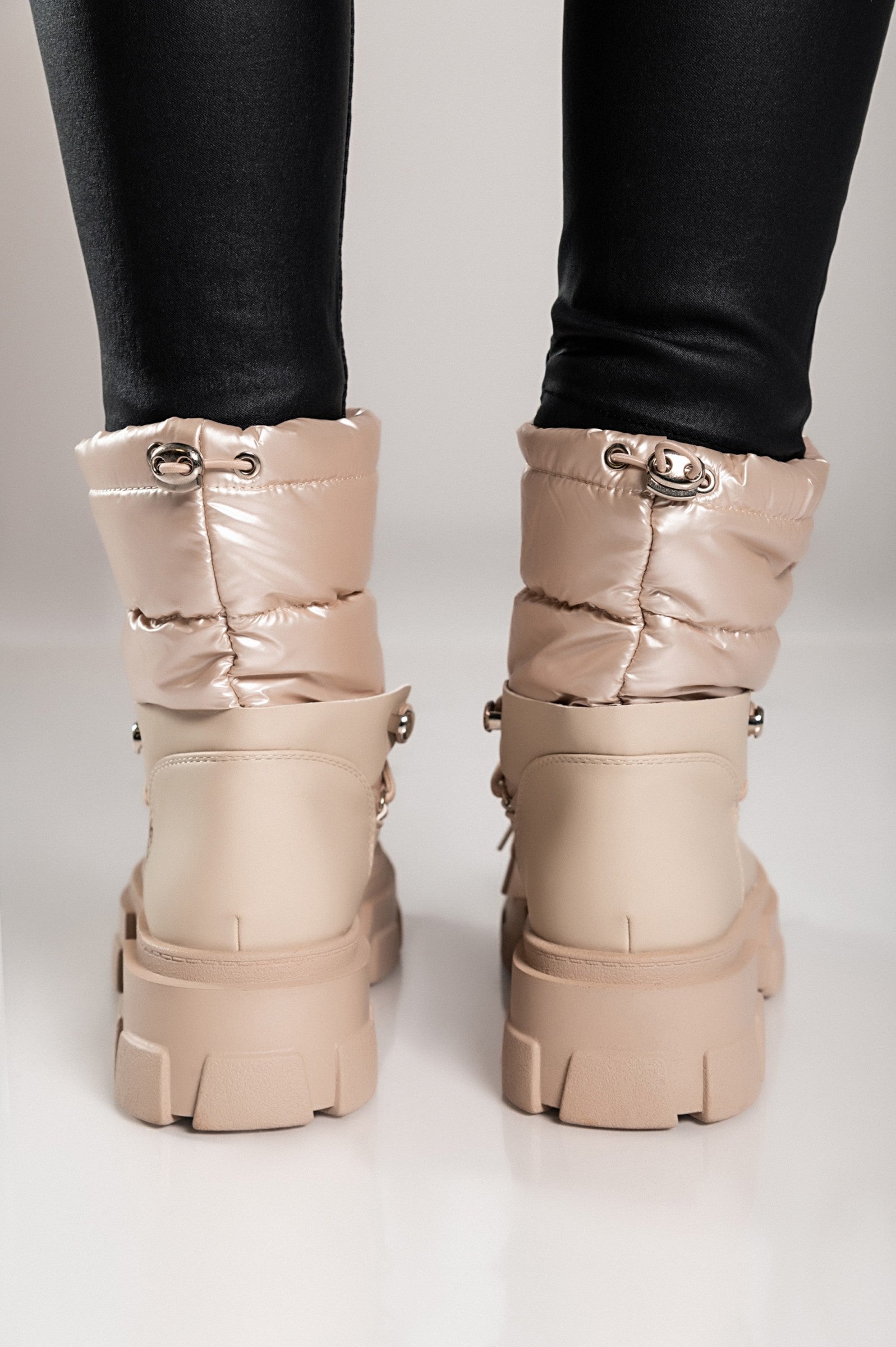 Beige warm ankle boots with bows, featuring a round toe and raised sole, perfect for stylish comfort.