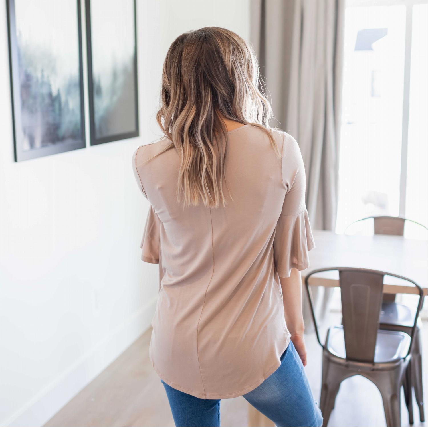 A stylish Waterfall Sleeve Top featuring a V-neck design and loose elbow-length bell sleeves, made from soft rayon fabric.