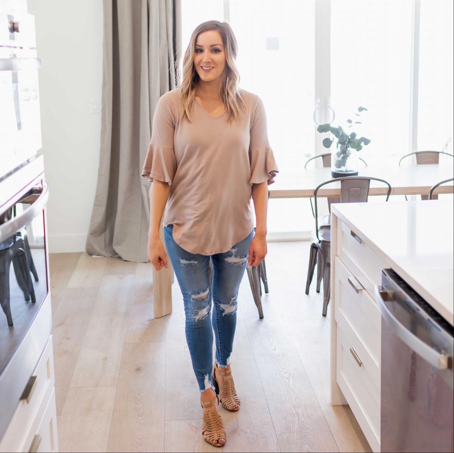 A stylish Waterfall Sleeve Top featuring a V-neck design and loose elbow-length bell sleeves, made from soft rayon fabric.