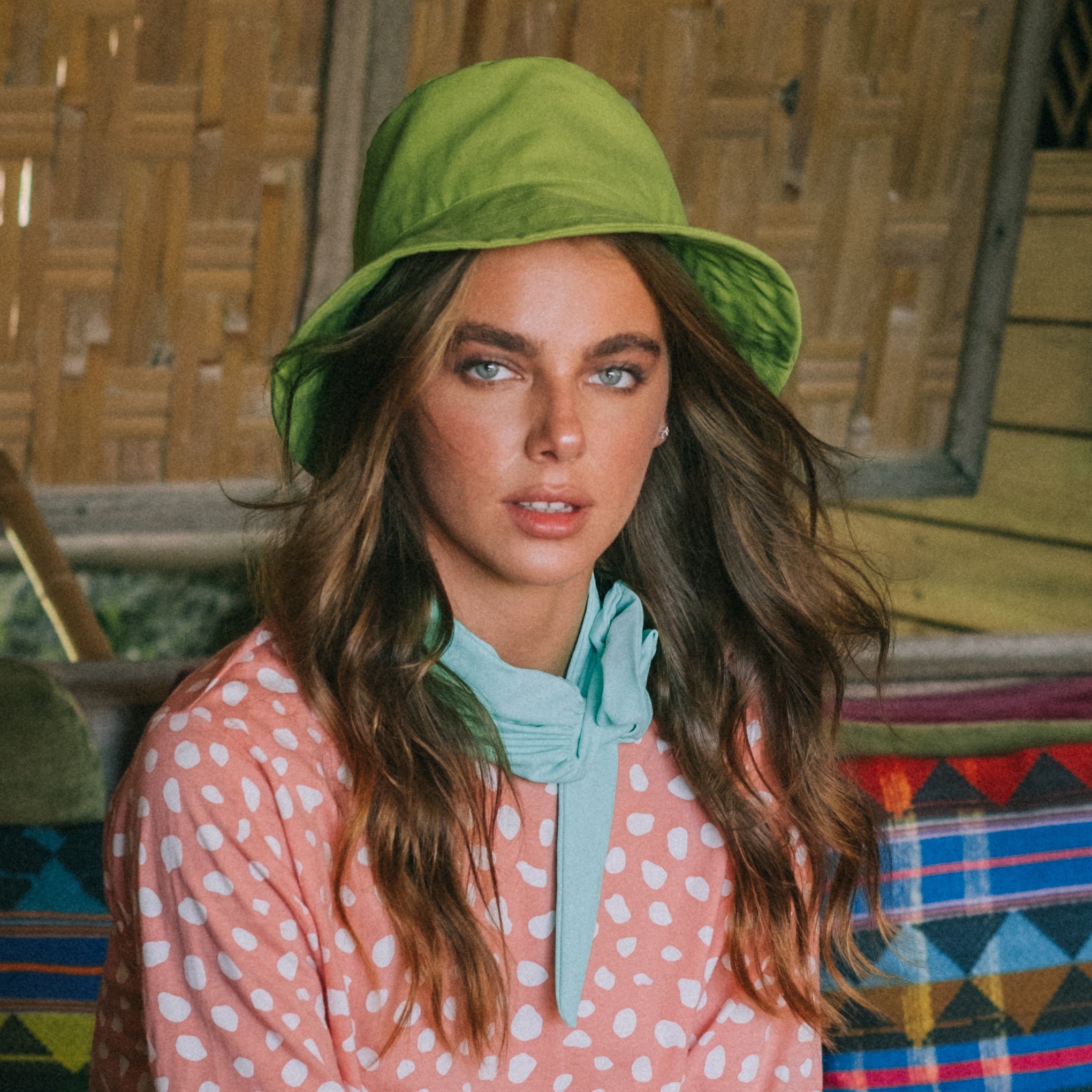 WATU Seaside Cotton Bucket Hat in vibrant lime green, showcasing its adjustable strap and soft cotton fabric, perfect for sunny days.