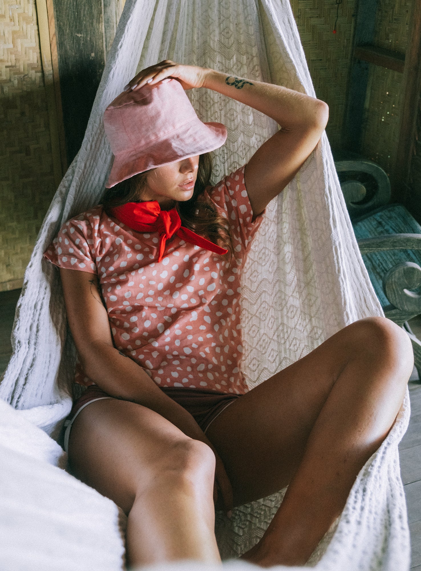 WATU Seaside Linen Bucket Hat in vibrant salt pink, showcasing its adjustable strap and breathable linen fabric.