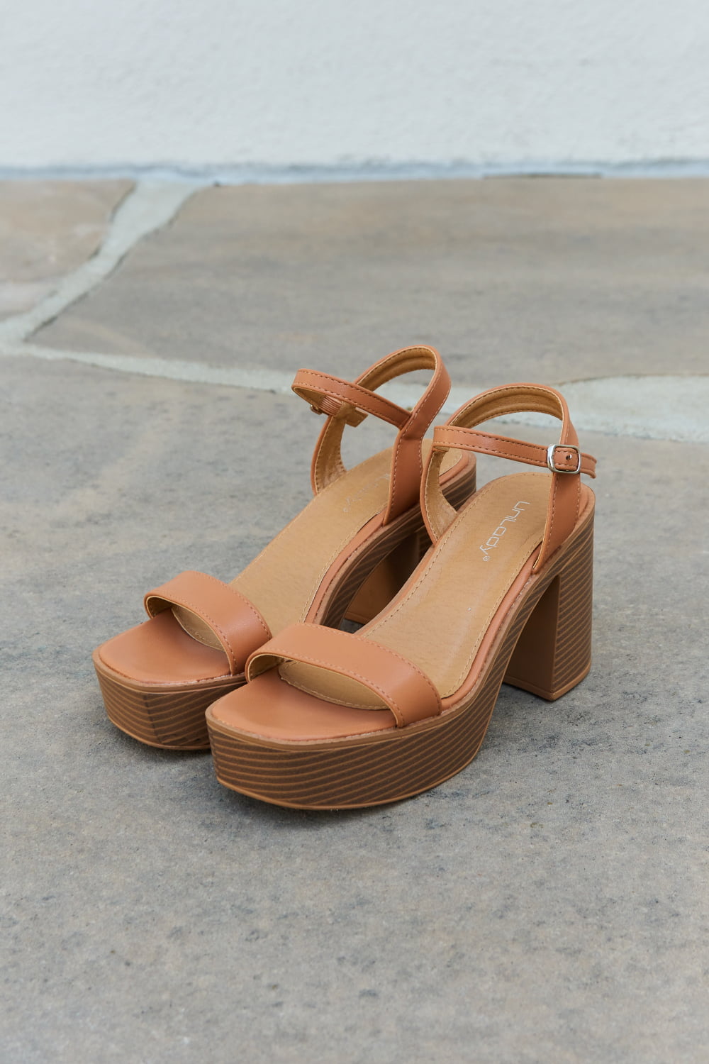 Weeboo Feel It Platform Heel Sandals featuring a sleek single strap and adjustable ankle buckle in a stylish design.