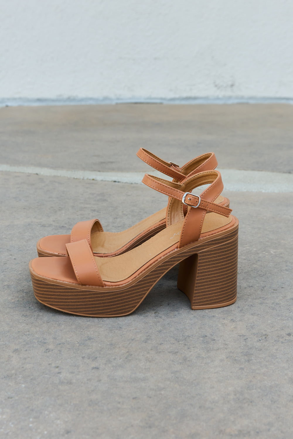 Weeboo Feel It Platform Heel Sandals featuring a sleek single strap and adjustable ankle buckle in a stylish design.