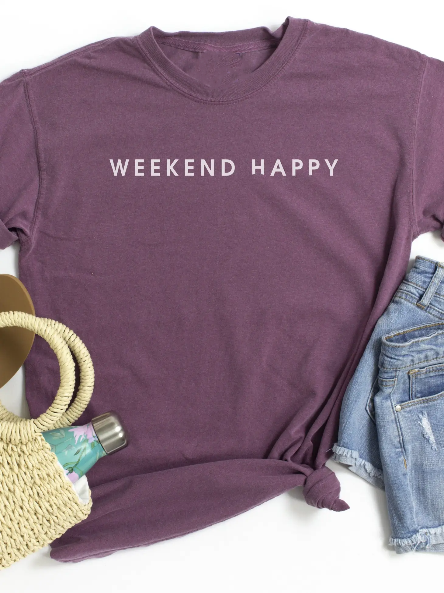 A stylish unisex Weekend Happy Tee, designed and printed in the USA, showcasing vibrant colors and a comfortable fit.