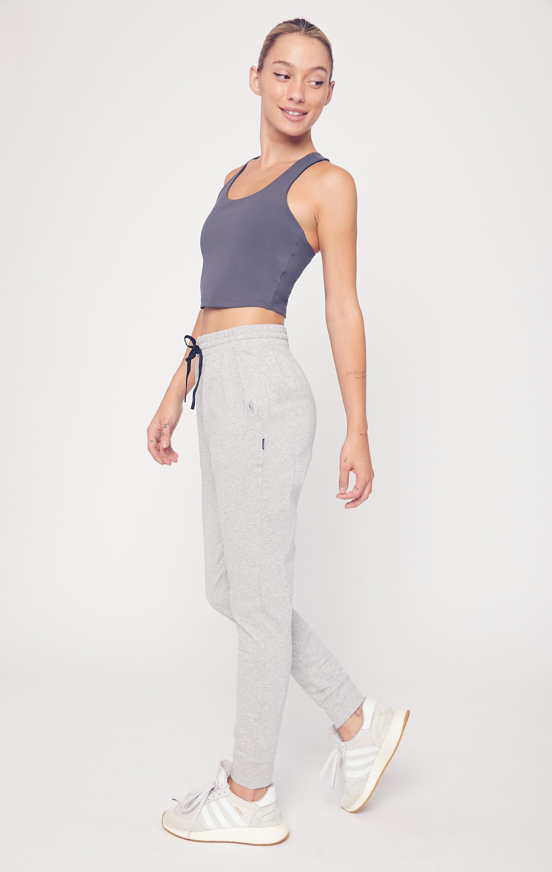 A pair of lightweight joggers designed for comfort and versatility, featuring pockets and drawcords, suitable for lounging and outdoor activities.