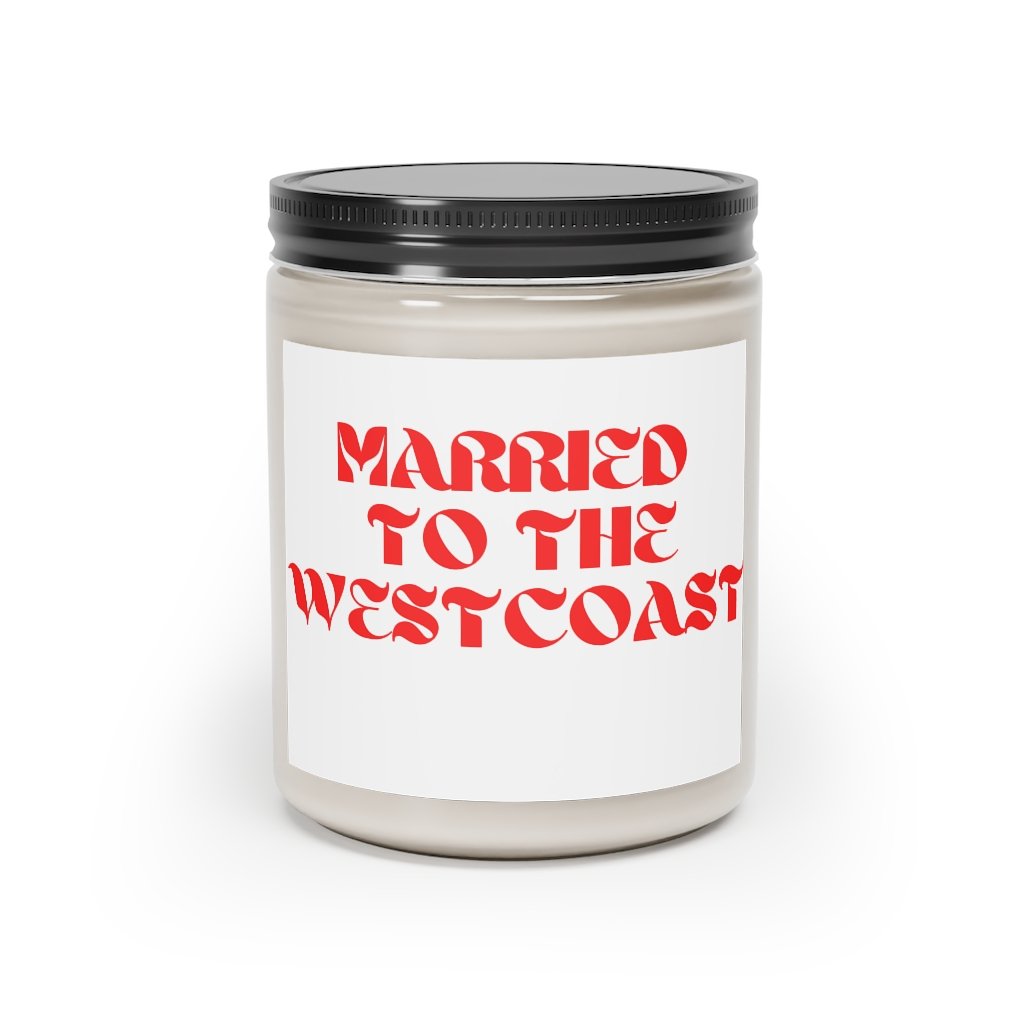 West Coast Love Affair scented candle in a glass container, featuring a warm glow and elegant label, available in Cinnamon Stick and Vanilla scents.