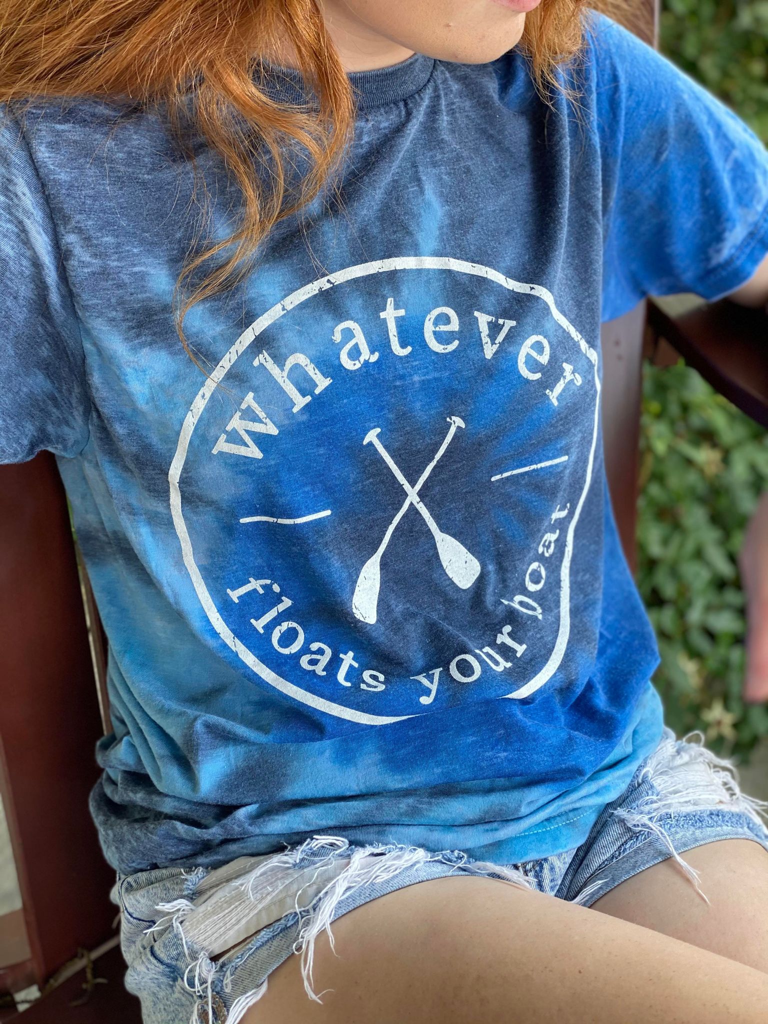 A vibrant tie-dye tee featuring a unique design with soft burnout fabric, perfect for summer wear.