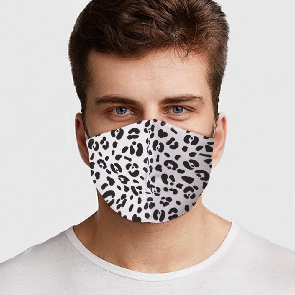 White Cheetah Face Cover with elastic ear bands, showcasing a stylish design and two layers of fabric for filtration.