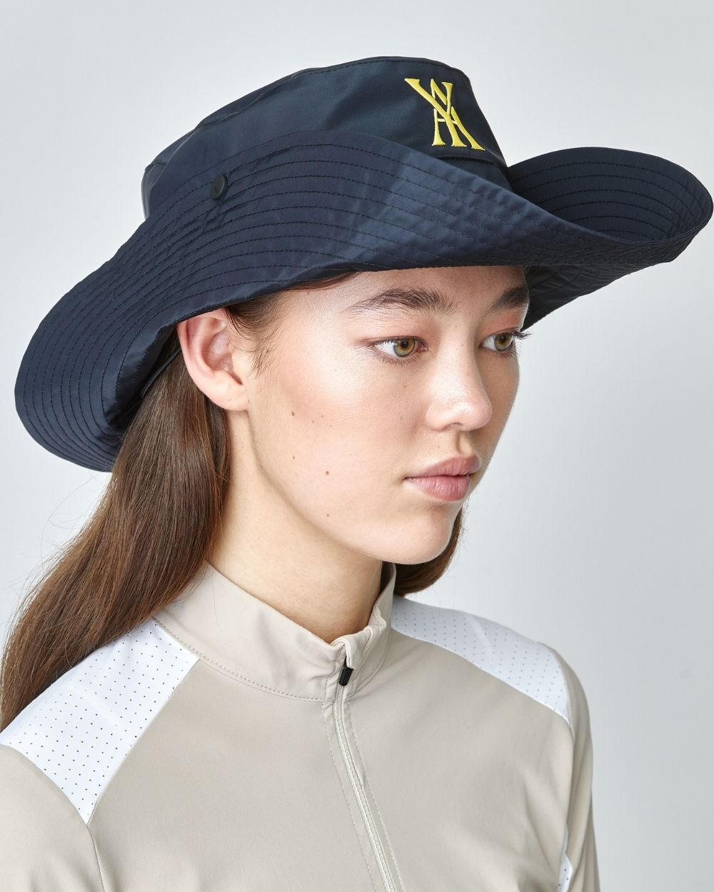 Wide Brim Hat Black with elongated brim and adjustable strap, made from recycled nylon, featuring an embroidered logo.