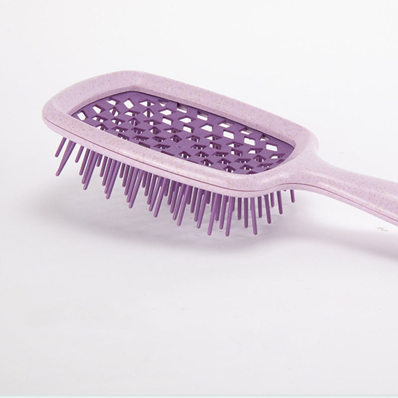 Wide Detangling Brush designed for textured and curly hair, featuring wide bristles for gentle detangling.