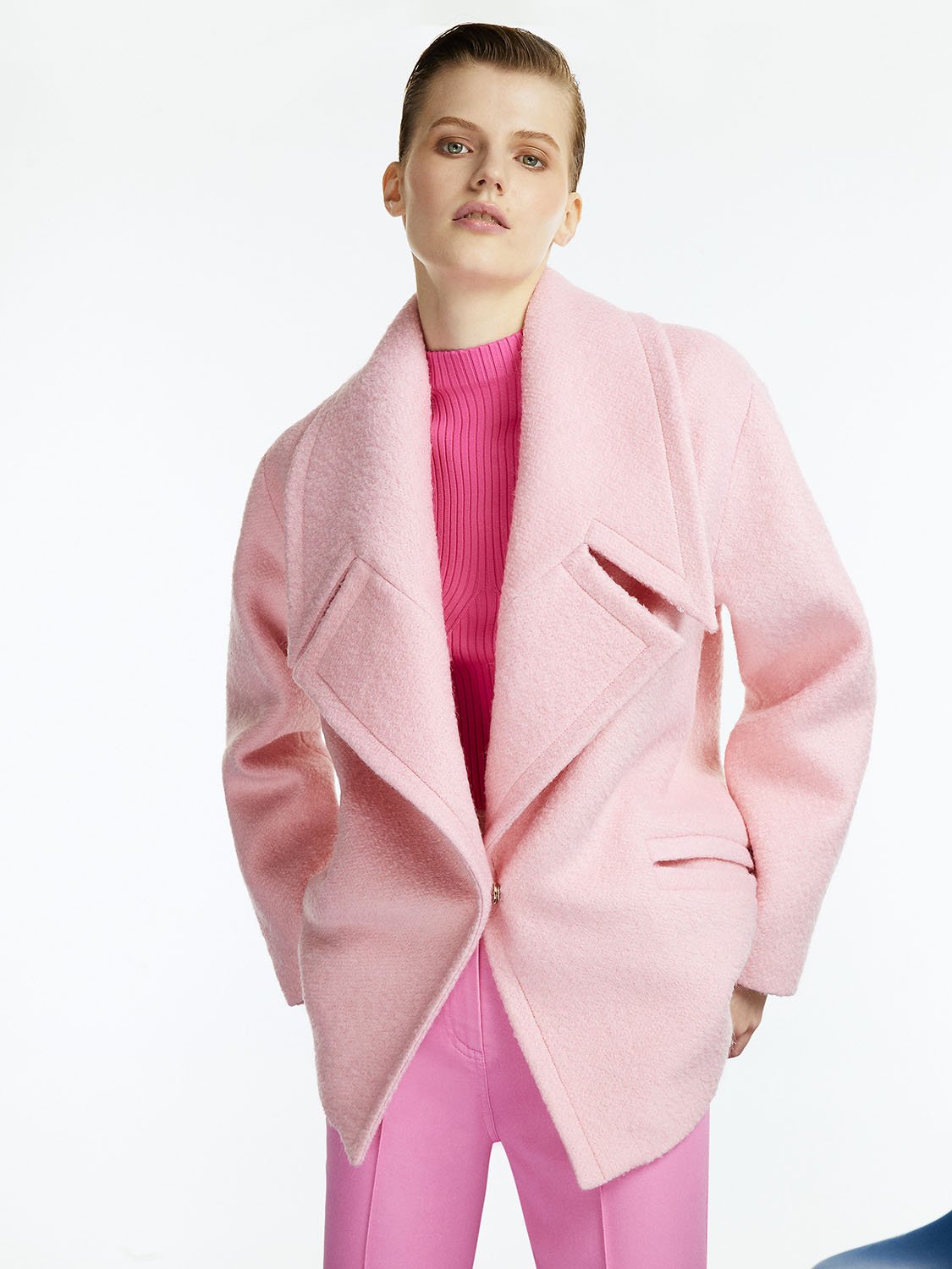 A stylish double-breasted wide lapel collar coat in vibrant orange, pink, and blue colors, featuring long sleeves and side flap pockets.