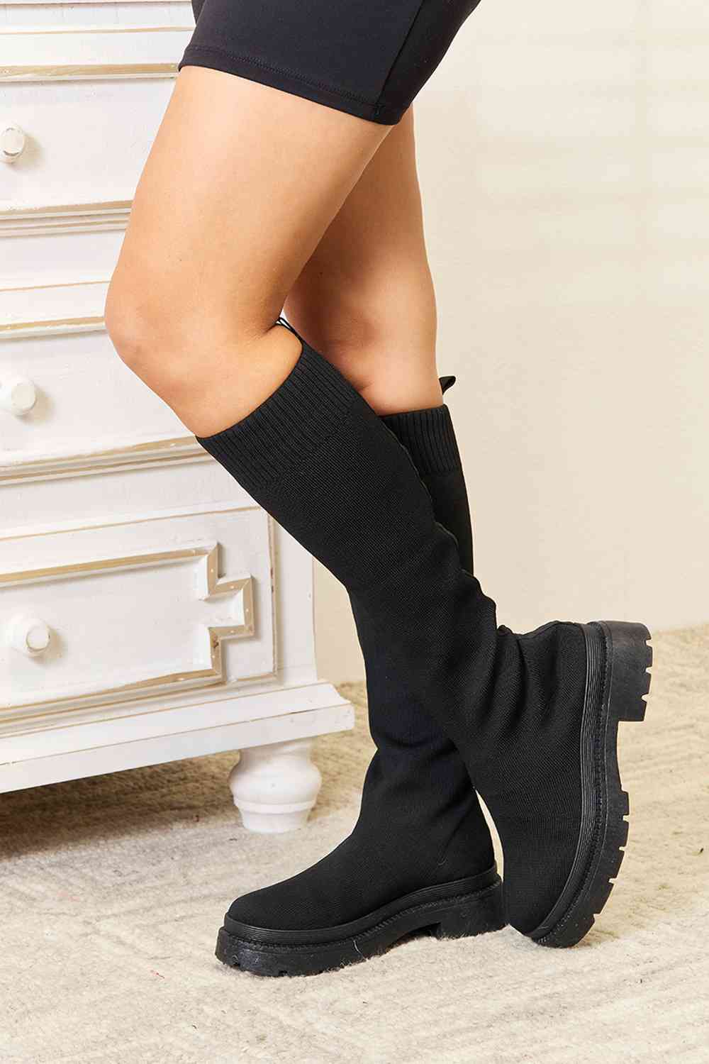 WILD DIVA Knee High Platform Sock Boots showcasing a sleek design with a snug fit and stylish platform sole.