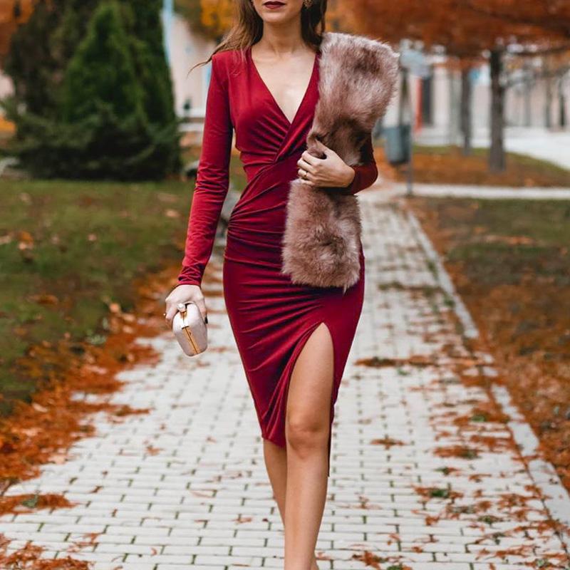 A stylish wine red v-neck pencil dress with full sleeves, featuring a draped design and knee-length cut, perfect for autumn and winter occasions.