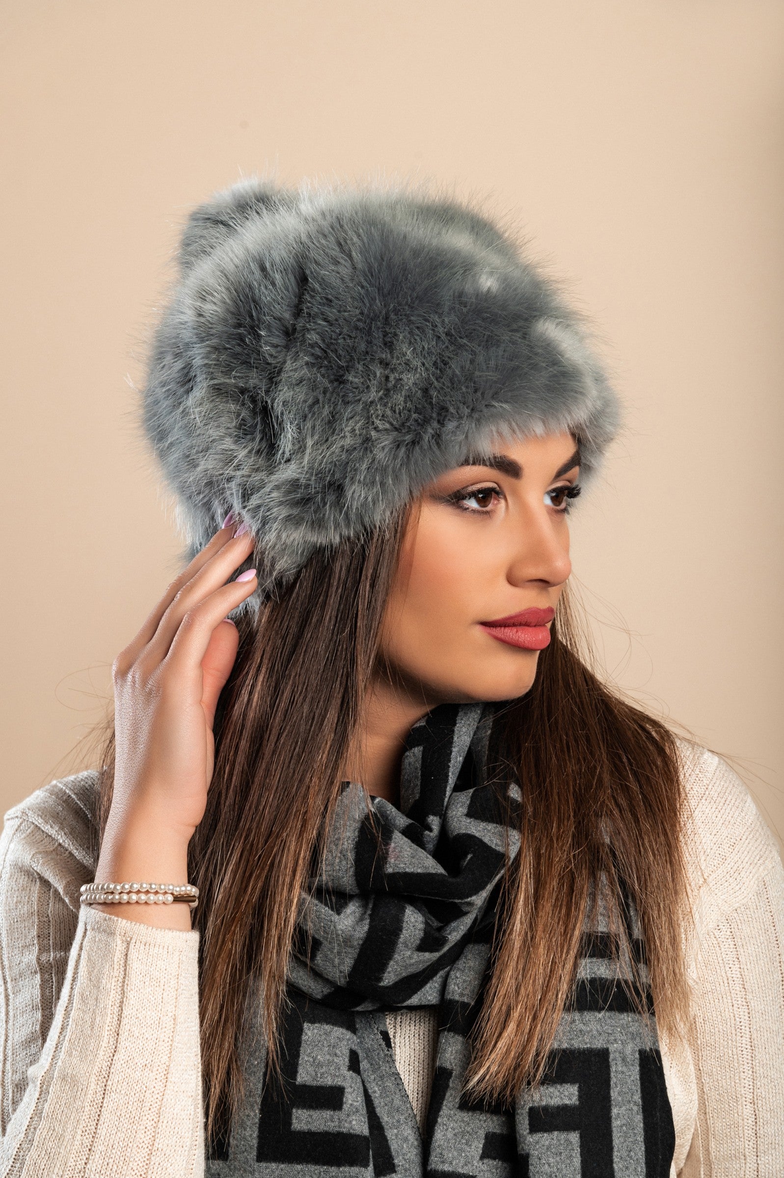 Elegant dark gray winter hat with soft synthetic fur, perfect for cold weather.