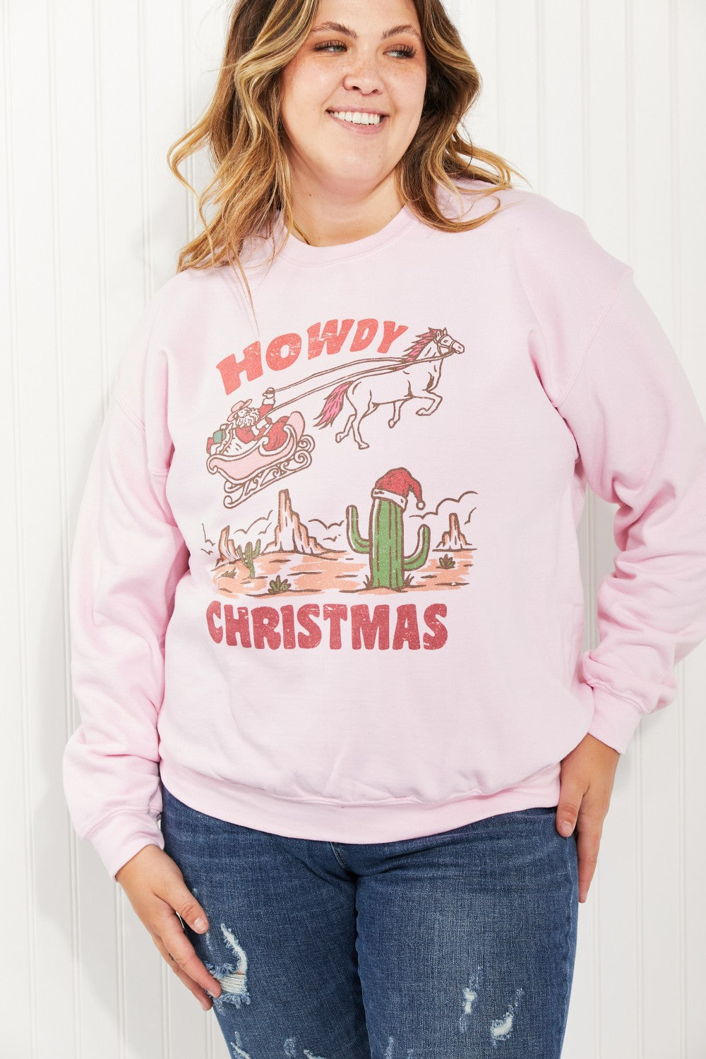 WKNDER Howdy Christmas Full Size Graphic Sweatshirt featuring a festive design with a round neck and long sleeves.