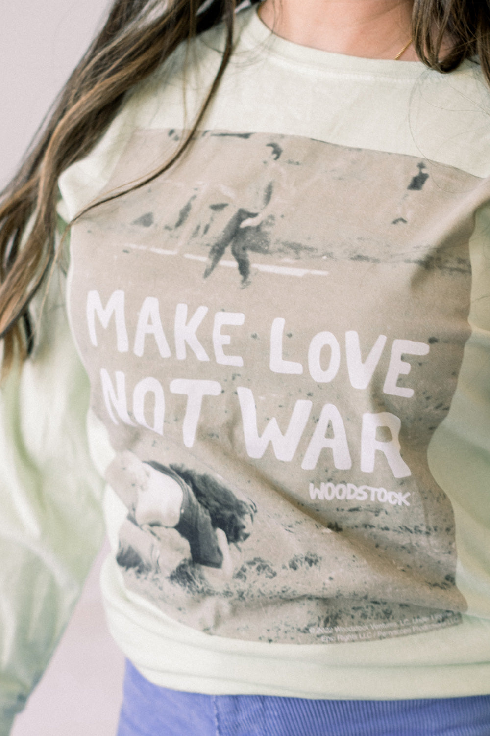 Woodstock Lover Long Sleeve shirt in Mint and Ivory colors, featuring a bold print with a message of love and peace.