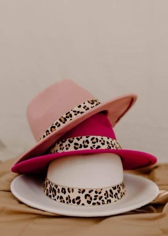 A stylish wool fedora hat with leopard trim, showcasing its elegant design and adjustable band.